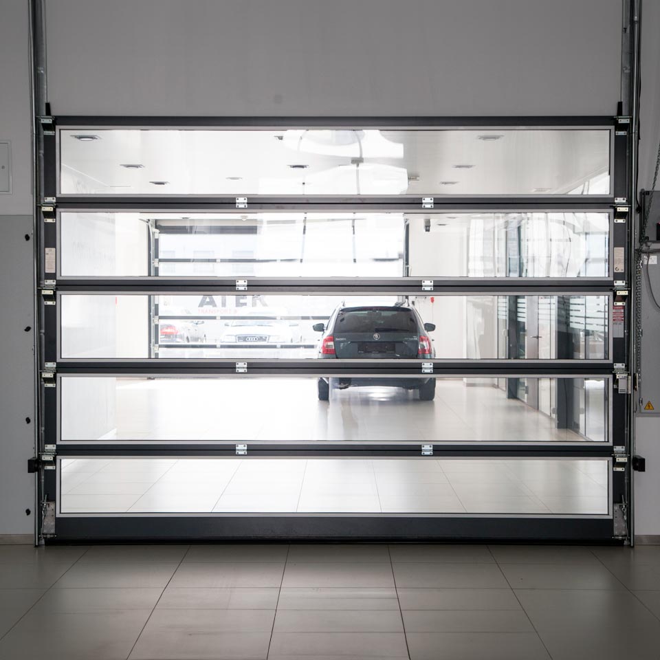 Portalp porte sectionnelle Alpha Deuren PANORAMA vitrée