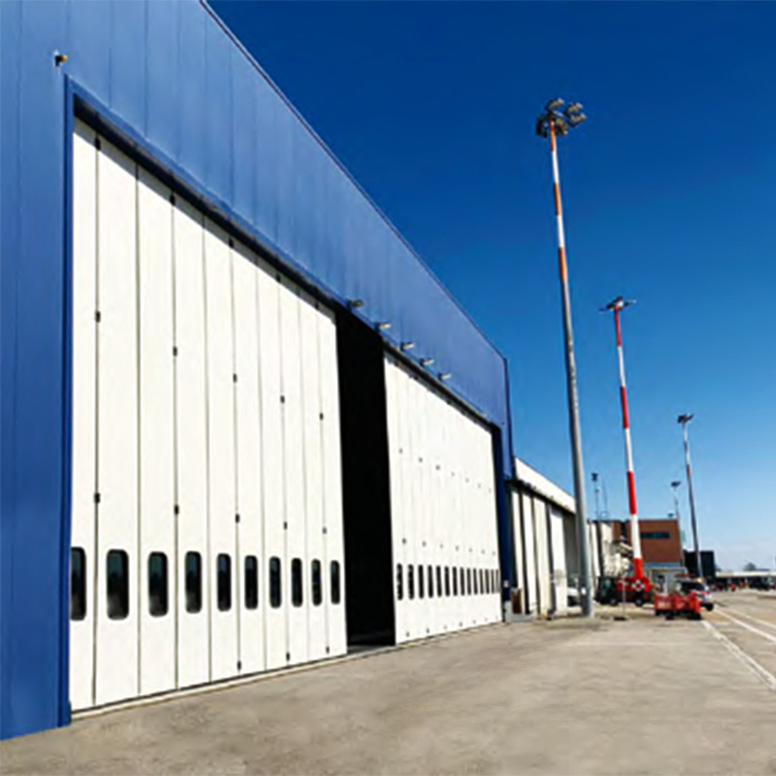 Portalp porte industrielle pliante grande dimension Moreschi blanche secteur industriel